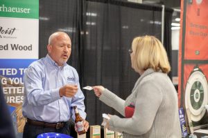 two people exchanging business cards at an event