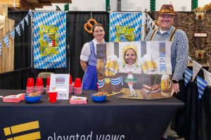 three people posing for a photo at an event